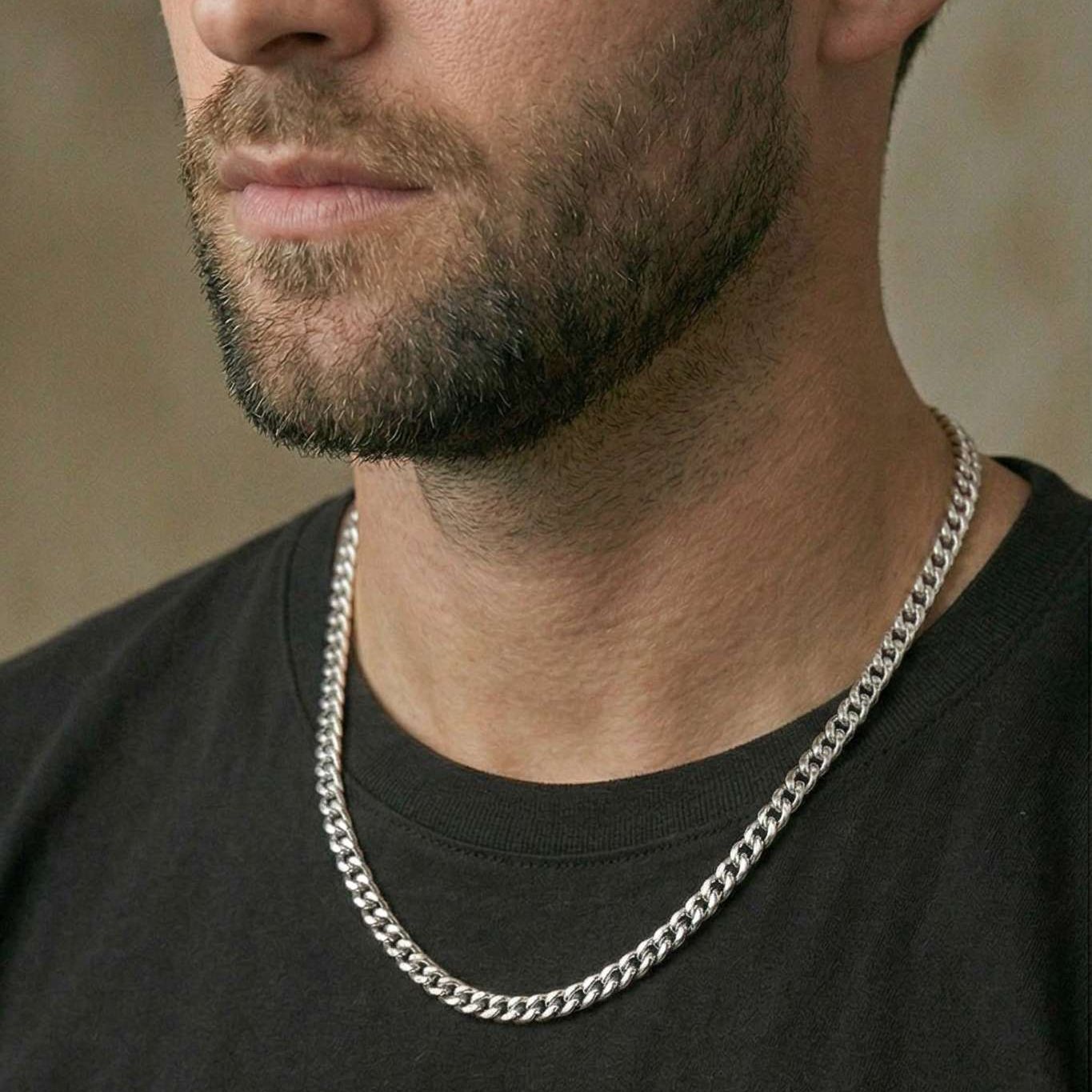 Side view of model styling the Matzzo 5mm silver Cuban chain with men's streetwear