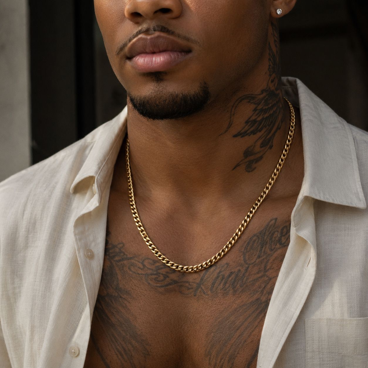 Model wearing Matzzo 5mm 18k gold Cuban link chain necklace, close-up look